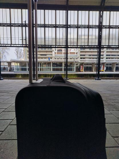 Photo of a suitcase on a platform 6 of Haarlem railway station.