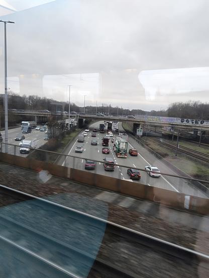 Photo taken out of the train to Brussels. The train is just crossing a bridge over the Antwerpen ring road.